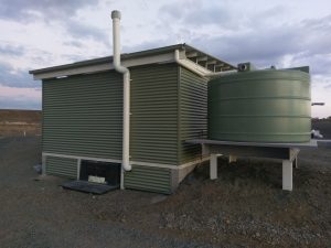 Behind the compost toilet building at the second range crossing