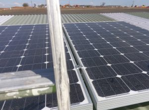 The solar panels on the roof that run the lights and fan.
